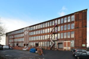 The outside of the BizSpace Rochdale Moss Mill office property and car park