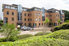 The exterior of Citibase Cambridge office property with car park