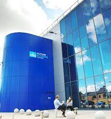 An external shot of Allia Future Business Centre, London Road, Peterborough, PE2 8AN with two people sitting and chatting in the foreground