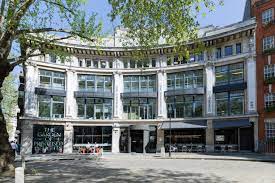 An external shot of CoWork Construct at Building Centre, 26 Store Street, West End of London, WC1E 7BT on a sunny day