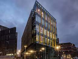 External shot of Colony Workspace Fabrica, 269 Great Ancoats Street in New Islington in Manchester at night