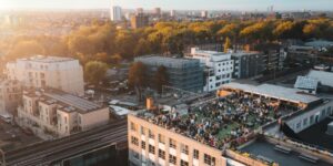 An aerial view of EatWorkArt, Netil House, London Fields, E8 3RL showing an event on the roof terrace