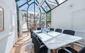 A well-lit meeting room available to hire at LentaSpace Putney - Hyde Park House, 5 Manfred Road, Putney, SW15 2RS