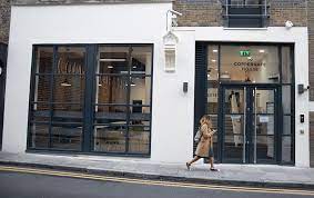 A shot of the entrance to LentaSpace Spitalfields - Coppergate House, 10 Whites Row London, E1 7NF with a lady walking by