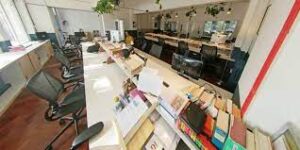 A bank of coworking desks at Mainyard Studios TOWER HAMLETS - 35 Bow Road, East London, E3 2AD