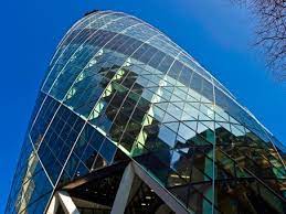 A view from the ground looking up at Signature - The Gherkin, St Mary Axe, London EC3A 8AF