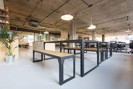 An image of bench-style desks in the coworking space at Techspace Aldgate East - 32-38 Leman Street, London E1 8EW