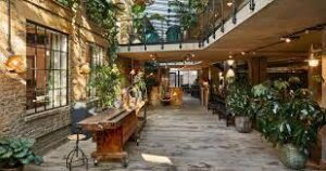 An internal shot of The Fisheries, 1 Mentmore Terrace, Hackney, London E8 3PN showing workspace areas with plants and biophilia