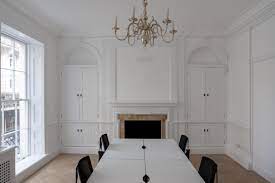 A meeting room with a chandelier at WorkPad - 22 King Street, St. James’s, London SW1Y 6QY