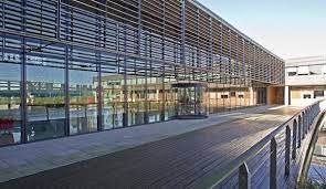 External shot of Basepoint Luton - Innovation Centre and Business Base, 110 Butterfield, Great Marlings, Luton, Bedfordshire LU2 8DL with the lake reflecting off the front elevation