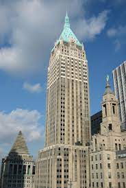 External shot of the Breather - Trump Building, 40 Wall Street, New York, NY 10005 with blue sky in the background