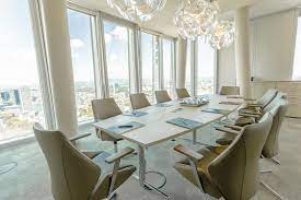 An elegant meeting room to hire at Collection Business Center Nextower Office Space in Frankfurt complete with chandeliers