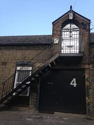The steps up to the loft space coworking area at Cooks Yard, 88 Mile End Road, Stepney Green, East London E1 4UN