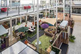 Looking down from an internal balcony at the co-working desk spaces at DeskLodge, Belvedere House, Basing View, Basingstoke RG21 4HG