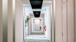 A corridor leading to office spaces to rent at Green House, Gibb Street Digbeth Birmingham B9 4AA