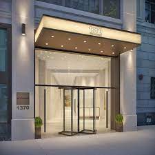 The entrance to the Jay Suites - 1370 Broadway, New York, NY 10018  office property at dusk