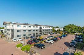 External shot of the Pure Offices Swindon - Pure Offices, Kembrey Park, Swindon, SN2 8BW commercial property showing the large car park