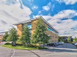 External shot of Rombourne, Kingston House, Great Western Way, Swindon SN5 8UB on a sunny day showing the trees in front of the office property