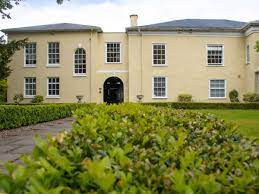 The front elevation of Rombourne, Trym Lodge, 1 Henbury Road, Bristol BS9 3HQ with greenery in the foreground