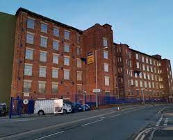 A shot of the Safestore Stockport - Kingston Business Centre, Chestergate, Stockport SK3 0AL office property at dusk