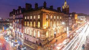 Aerial shot at night of The Corner Office Building in Newcastle