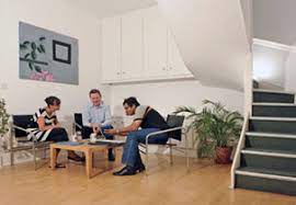 An informal meeting in a break-out space at 4 Evelyn Road, Chiswick, London W4 5JL