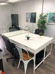 An office to rent at VITAXO Westbourne Grove - 42 Westbourne Grove, London W2 5SH with a large plant against the wall