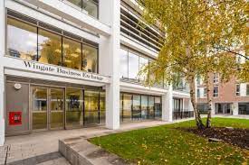 Exterior shot of Wingate Business Exchange in Clapham Old Town with a tree in the foreground