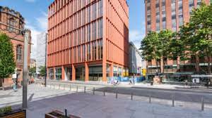 Wide shot of Regus - 125 Deansgate, Manchester M3 2LH with John Rylands Library in the left hand edge of the shot