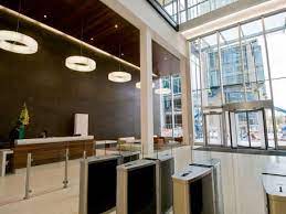 Reception desk and security turnstiles at Regus - 3 Hardman Street, Spinningfields, Manchester, M3 3HF