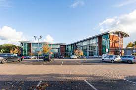 Wide external shot of Regus - Herons Way, Chester Business Park, Chester, Cheshire CH4 9QR office building and the car park