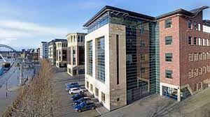 Aerial shot of Regus - Rotterdam House, 116 Quayside, Newcastle upon Tyne NE1 3DY showing the car parking and the River Tyne