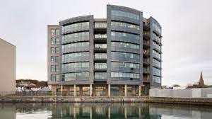 Wide shot of Regus - Salt Quay House, 6 North East Quay, Sutton Harbour, Plymouth PL4 0HP office property with water in the foreground