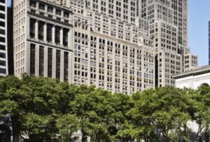 An external shot of Studio - 11 West 42nd Street, New York, NY 10036 office building with trees in the foreground