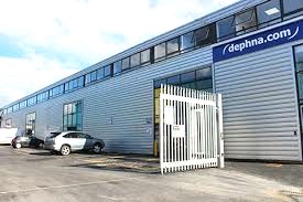 External shot of the Dephna offices at 1-3 Britannia Way, London, NW10 7PR showing the car parking area