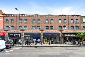 A view from across the street of Sub800 - 120 Camden High Street, Kings Cross, London, W1G 0HY on a sunny day