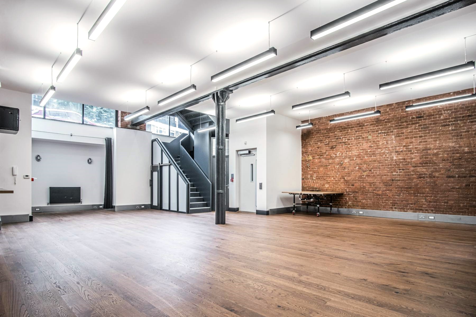 A large open plan office suite to let with wooden floors and exposed brickwork at Sub800 - 65-69 East Road, Shoreditch, London, N1 6AH