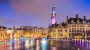 Bradford city centre of night with City Park in the foreground 