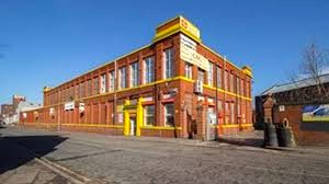 An external shot of GRG HOuse on Cobden Street in Salford on a sunny day