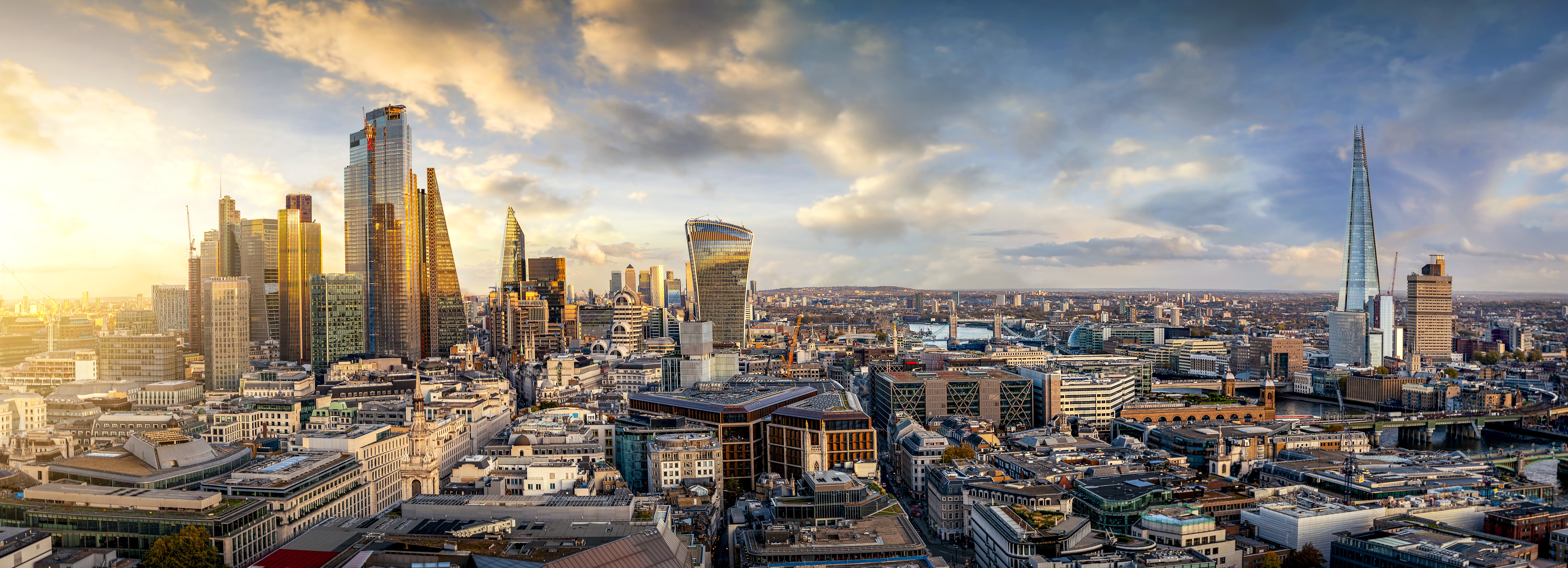 Cityscape of London as the sun rises showing various office buildings including The Shard