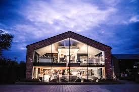 An exterior shot of The Colony - Altrincham Road, Wilmslow Cheshire, SK9 4LY at night