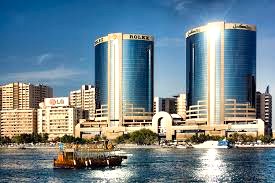 Shot of IBC - Twin ROLEX Towers, Deira, Dubai with an Abra on Dubai Creek in the foreground