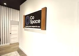 The CoSpace logo on the wall of its Austin building