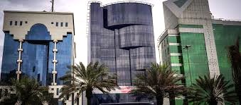 A view from the street of WTC - Bahrain Tower, King Fahd Road, Riyadh, Saudi Arabia with palm trees in the foreground