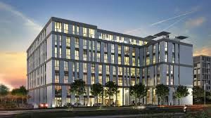 An external shot of Collection Business Center - Berlin Airport, Kienberger Allee 4, D-12529 Schönefeld at dusk